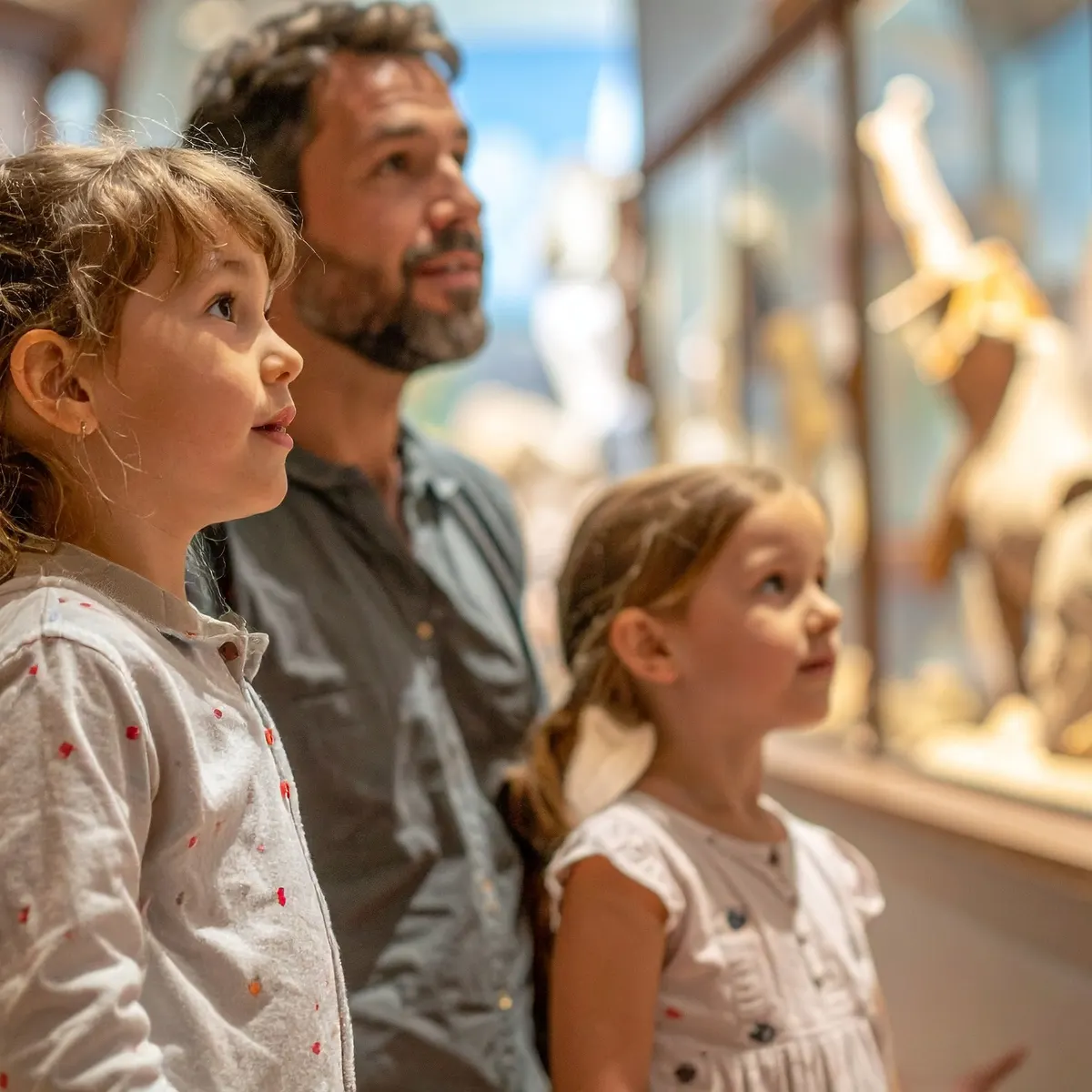 A family viewing an exhibit at a Tunisian museum