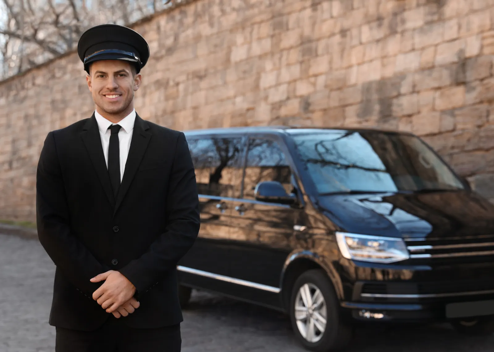 A pre-booked private transfer driver waiting at arrivals