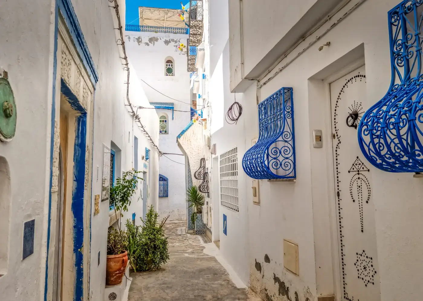 Blue door in a whitewashed alley