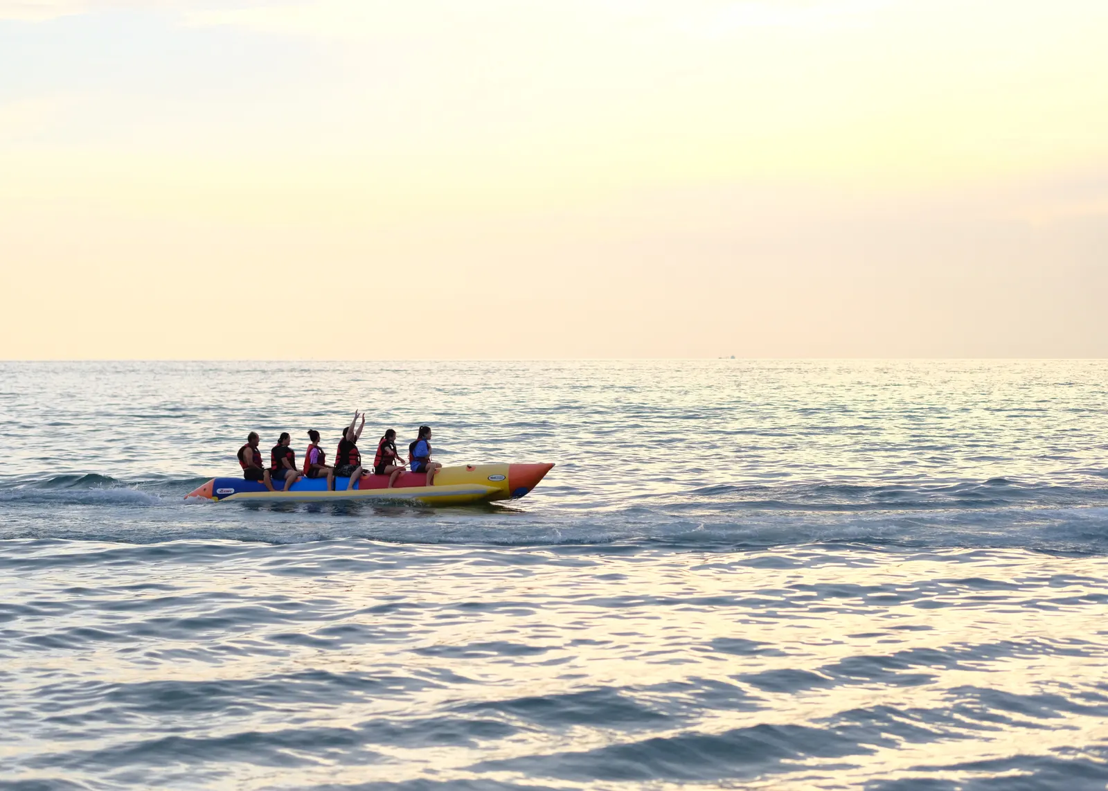 Jet ski, parasail and banana boats on a Tunisian beach